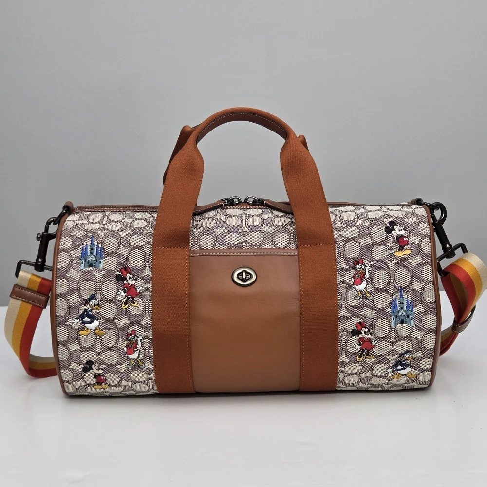 DISNEY X COACH DUFFLE BAG - SIGNATURE TEXTILE JACQUARD MICKEY MOUSE AND FRIENDS
